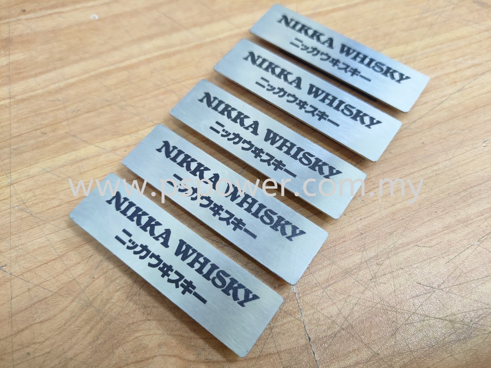 Laser marking on name tag with magnet