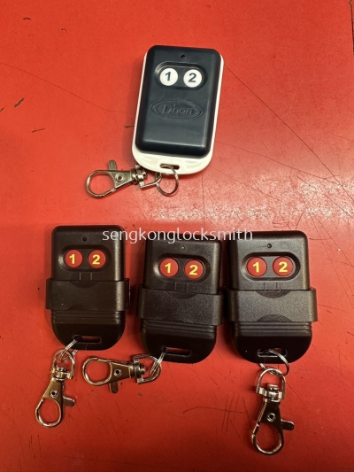 Professional locksmith duplicating home door remotes