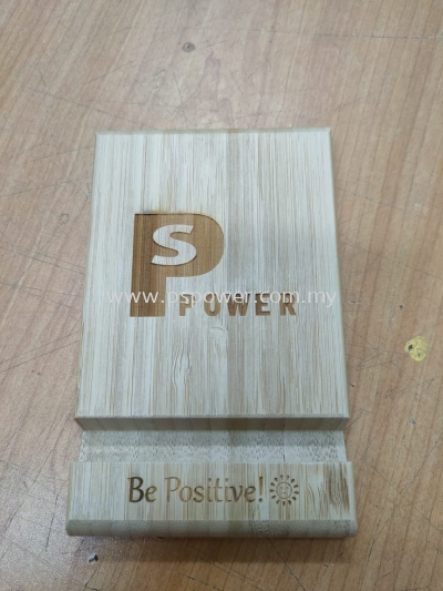 Laser engraving on wooden phone stand