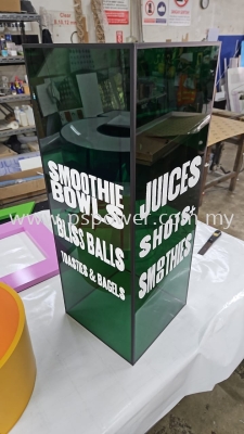 Tinted green acrylic box with white sticker wording