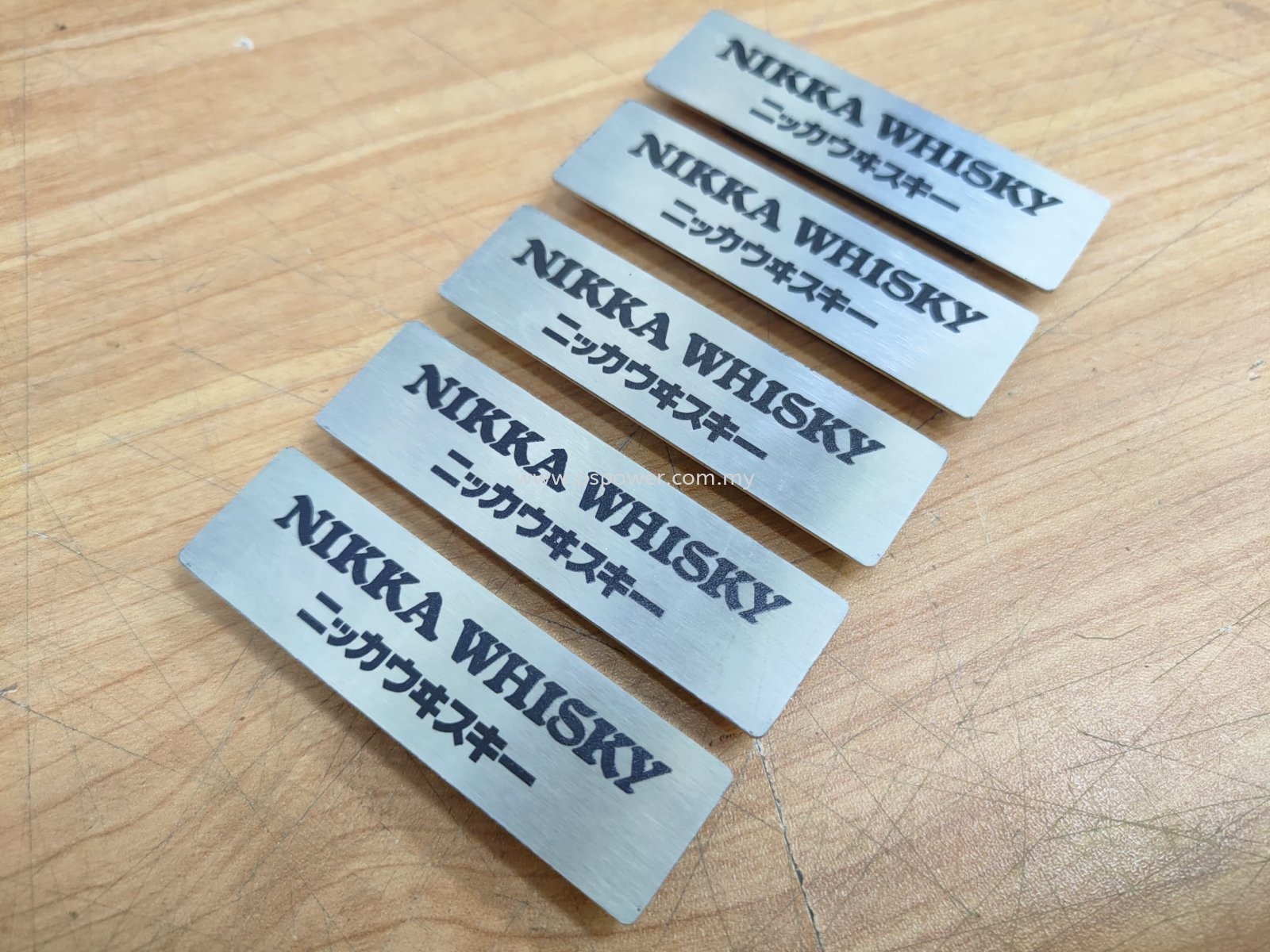 Laser marking on name tag with magnet