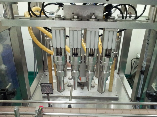 adding output nozzles to automatic filling machine