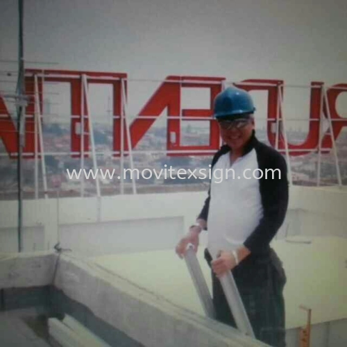 inspection after installing at roof top building  neon sign 