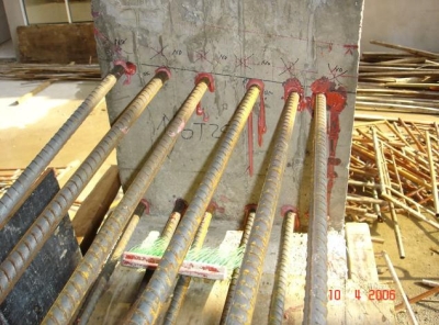 Drilling and fixing starter bar to column.