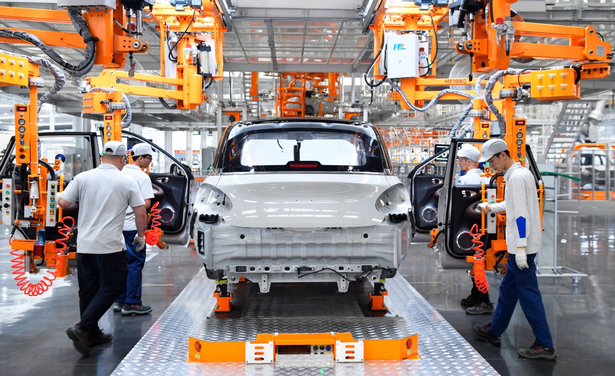 China says committed to dialogue to resolve EV tariff dispute with EU