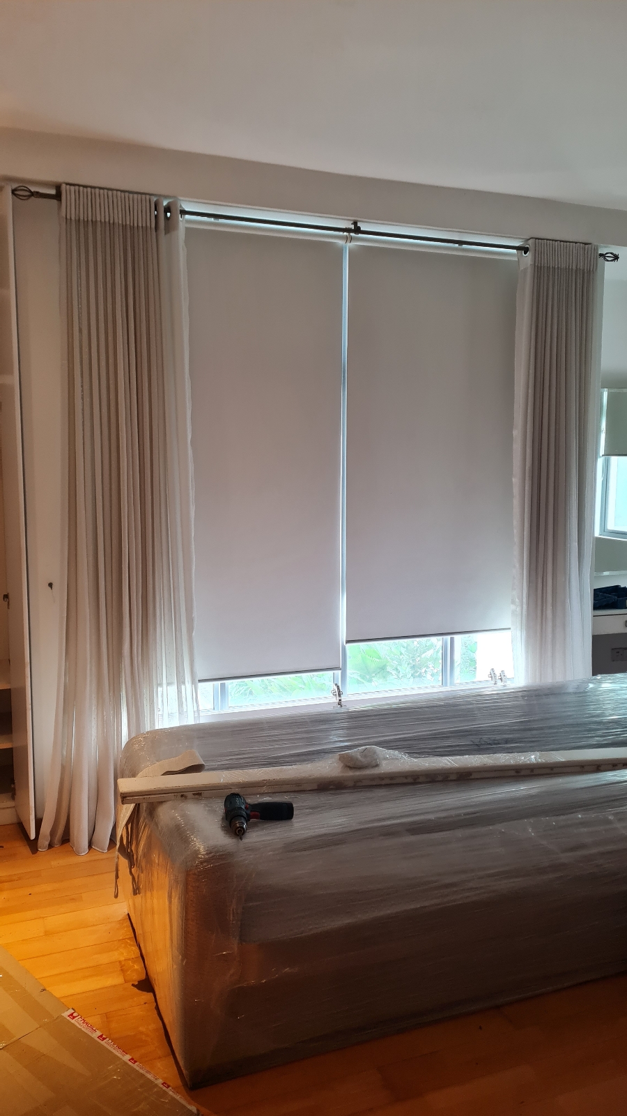 Sheer curtain and roller blind