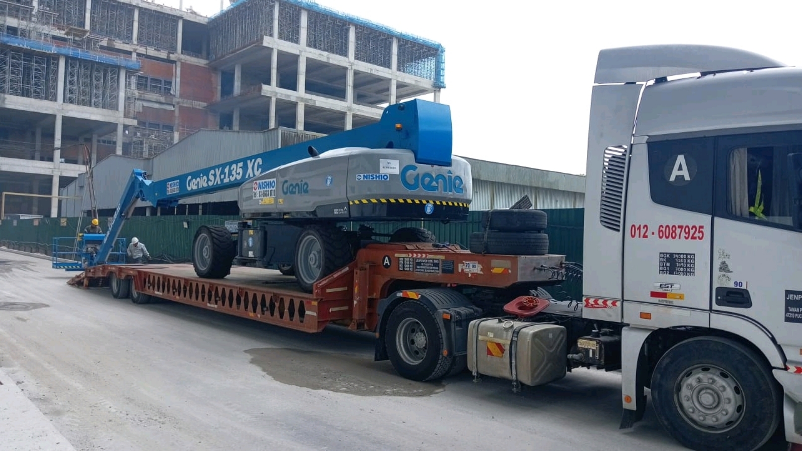 low loader delivery boomlift in Selangor.