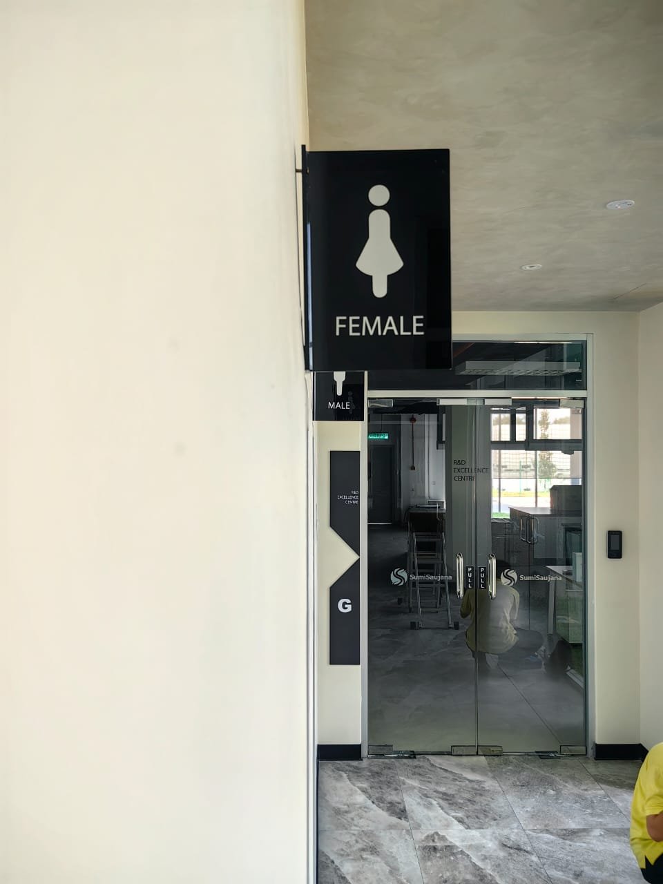 Acrylic Toilet Sign on Wall
