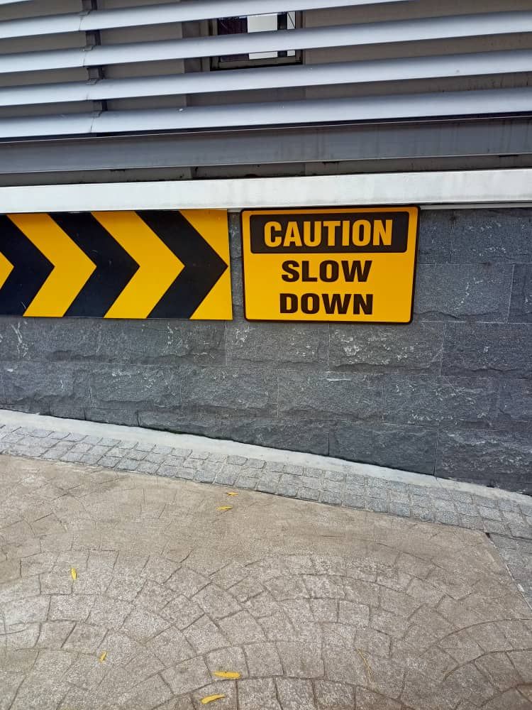 Safety signage Caution Slow Down 