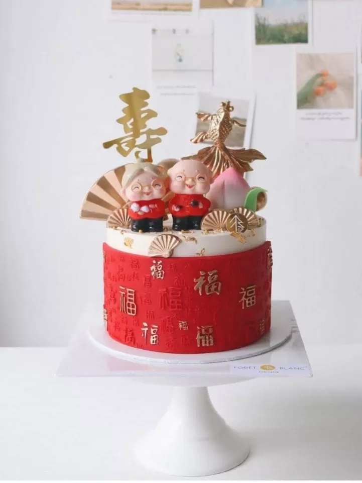 Elderly Couple Longevity Cake