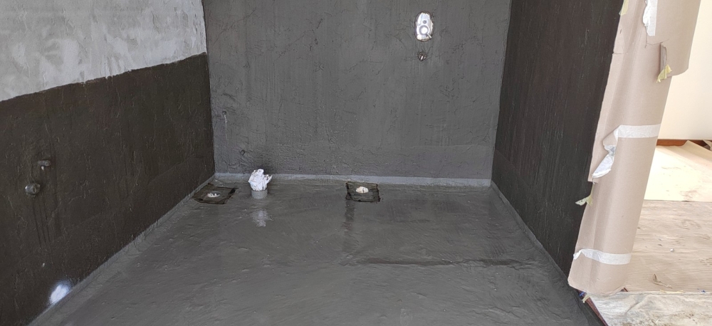 Cementitious waterproofing for toilet