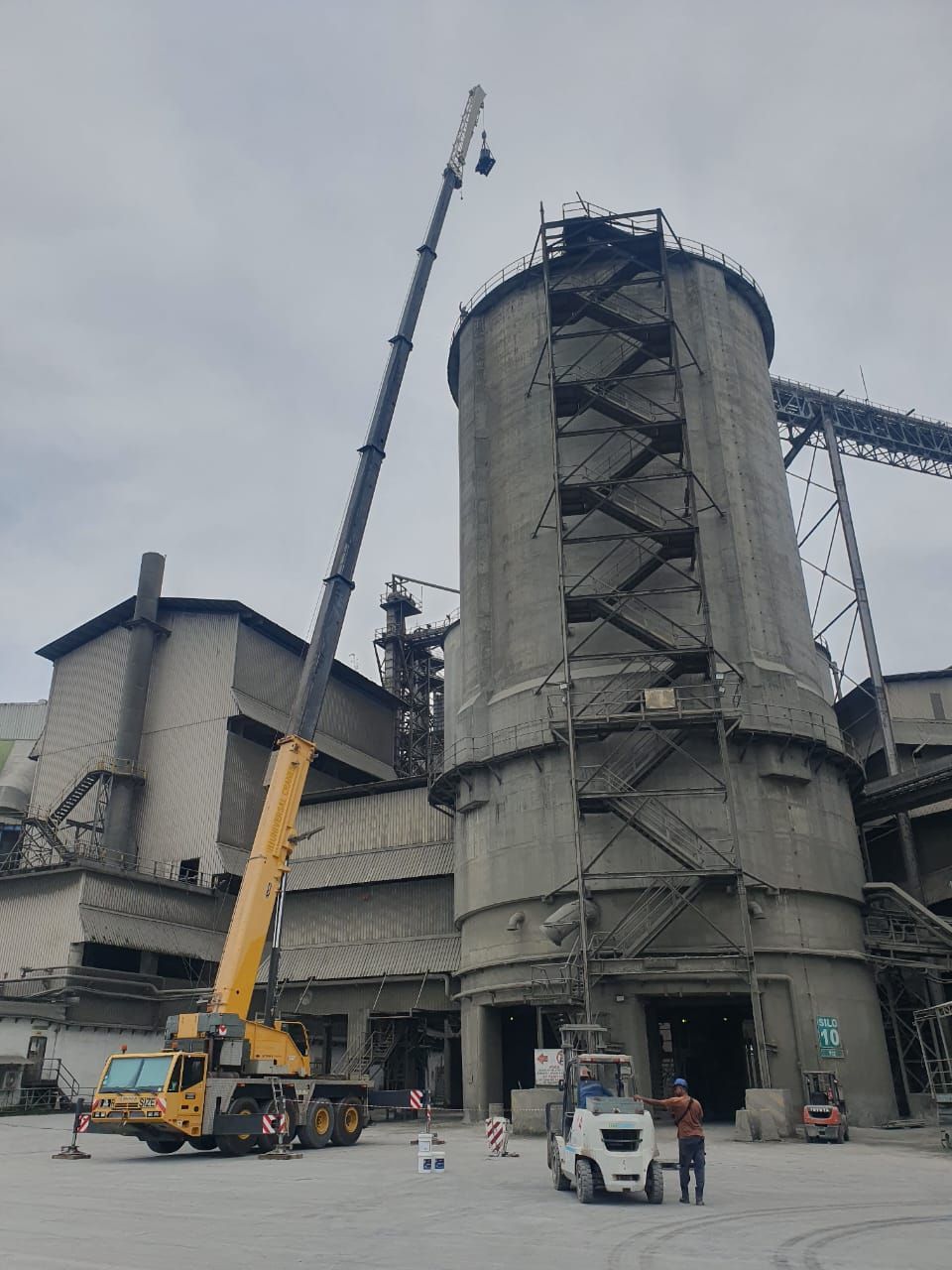 Hoisting Up Material To The Facilities Roof And Unloading All The Hacked Debris In Progress