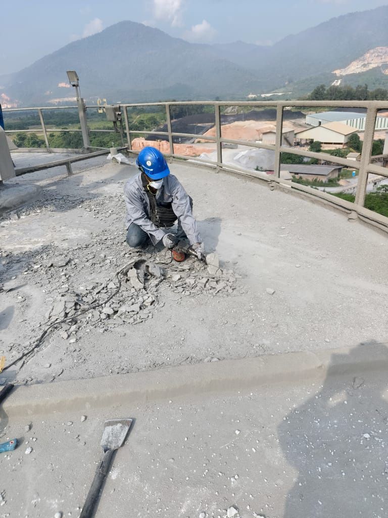 To Chip Off All The Hardened Layer Of Accumulated Cement Dust Until The Sound Substrate