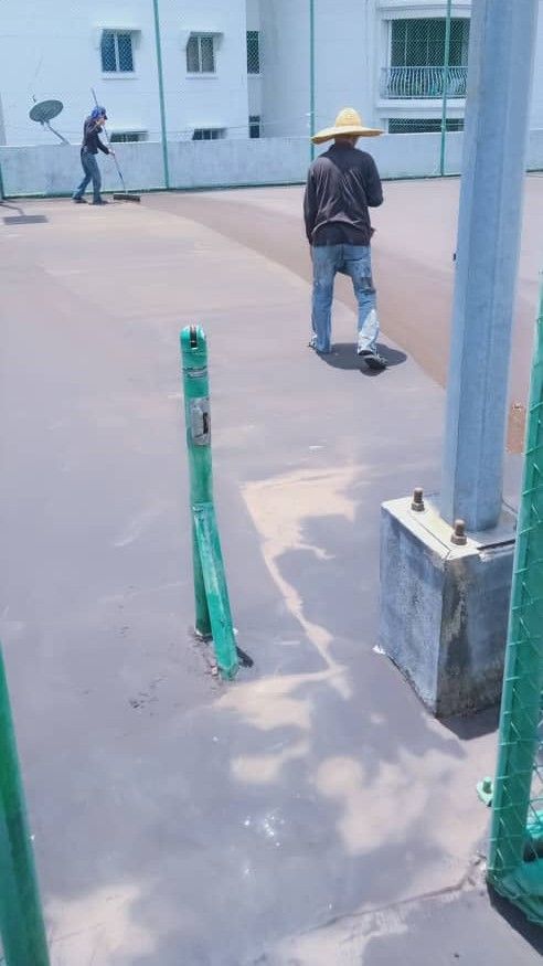 Application Of 2nd Layer Of Bitumen Mastic Base Cushioning Coatby Rubber Squeegee Tool  In Progress