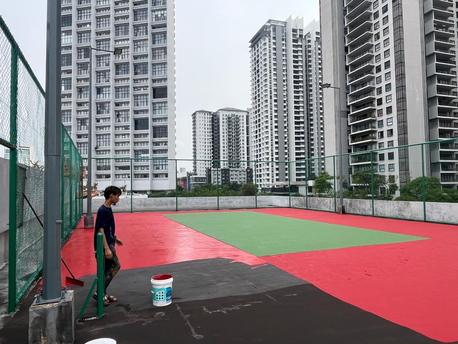 Application Of 1st Coat Of Acrylic Colour Coating By Rubber Squeegee Tool