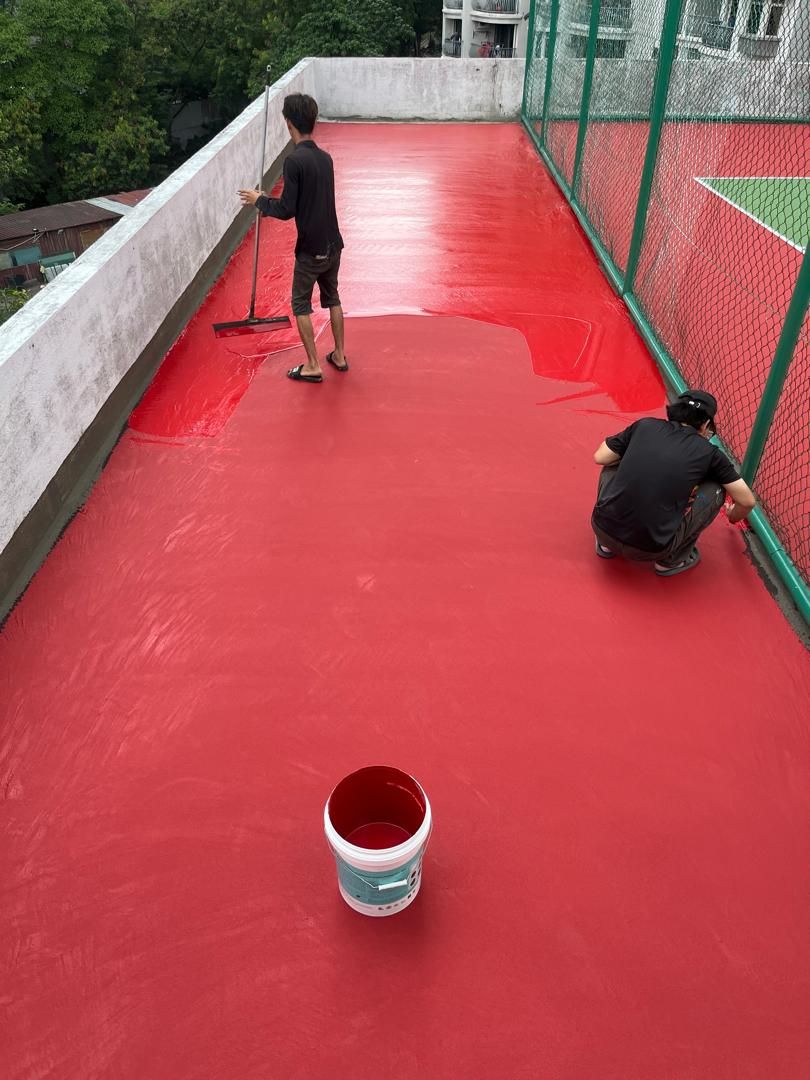 Application Of 2nd Coat Of Acrylic Colour Coating By Rubber Squeegee Tool In Progress