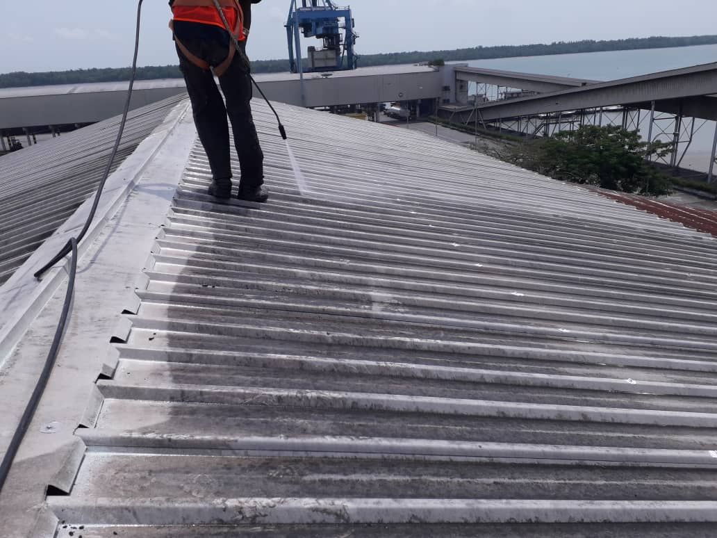 Waterjetting The Metal Roof Surface To Remove All Rust, Dirt And Loose Particles