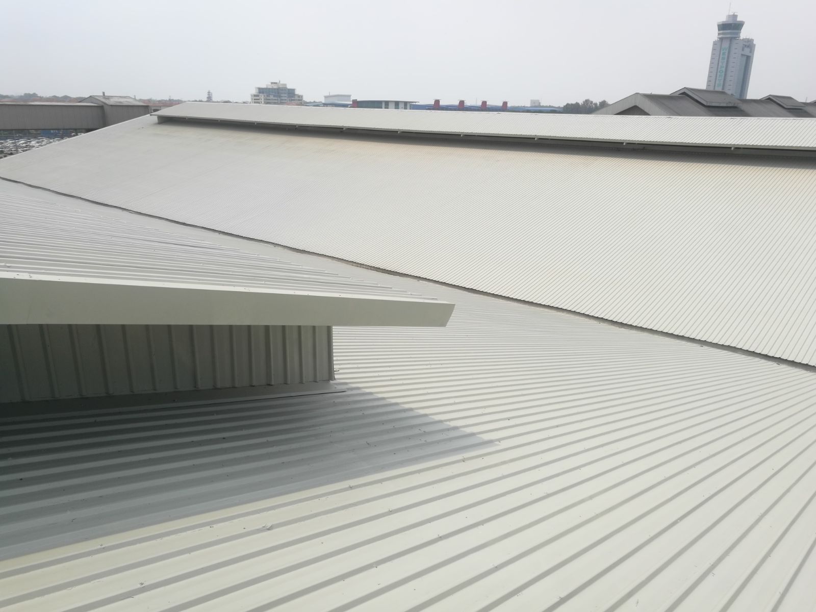 Anti Rust Cum Protective Coating Over A Metal Roof Of Warehouse
