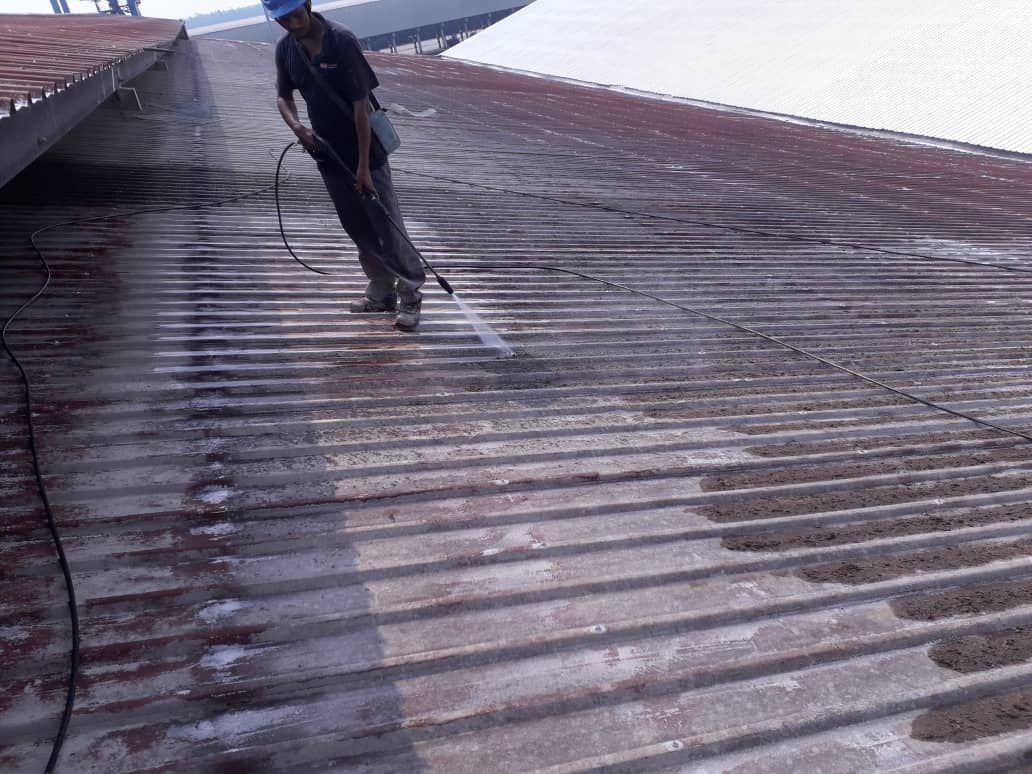 Waterjetting The Metal Roof Surface To Remove All Rust, Dirt And Loose Particles