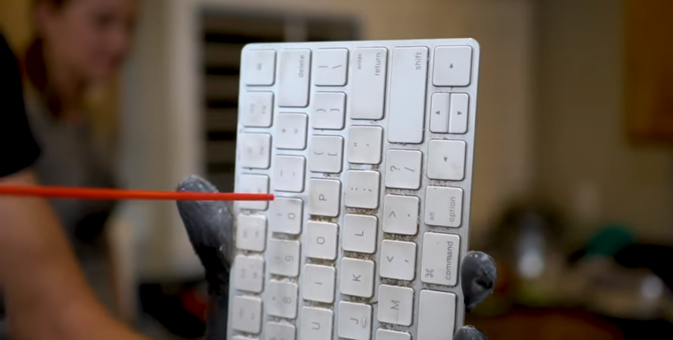 cleaning keyboard with air duster