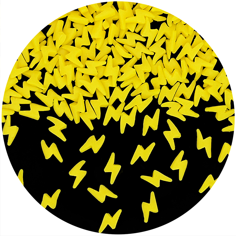 Precision-cut natural yellow lightning bolt confetti sprinkles for superhero-themed bakery and industrial confectionery