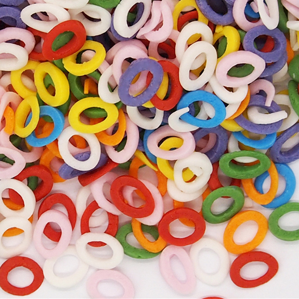 Industrial bulk supply of lifebuoy-shaped sprinkles for seaside-themed bakery.