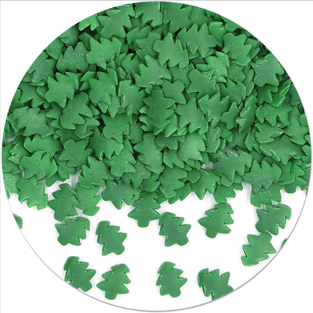 Bulk solid Christmas tree sprinkles colored with spirulina and turmeric for industrial bakery.
